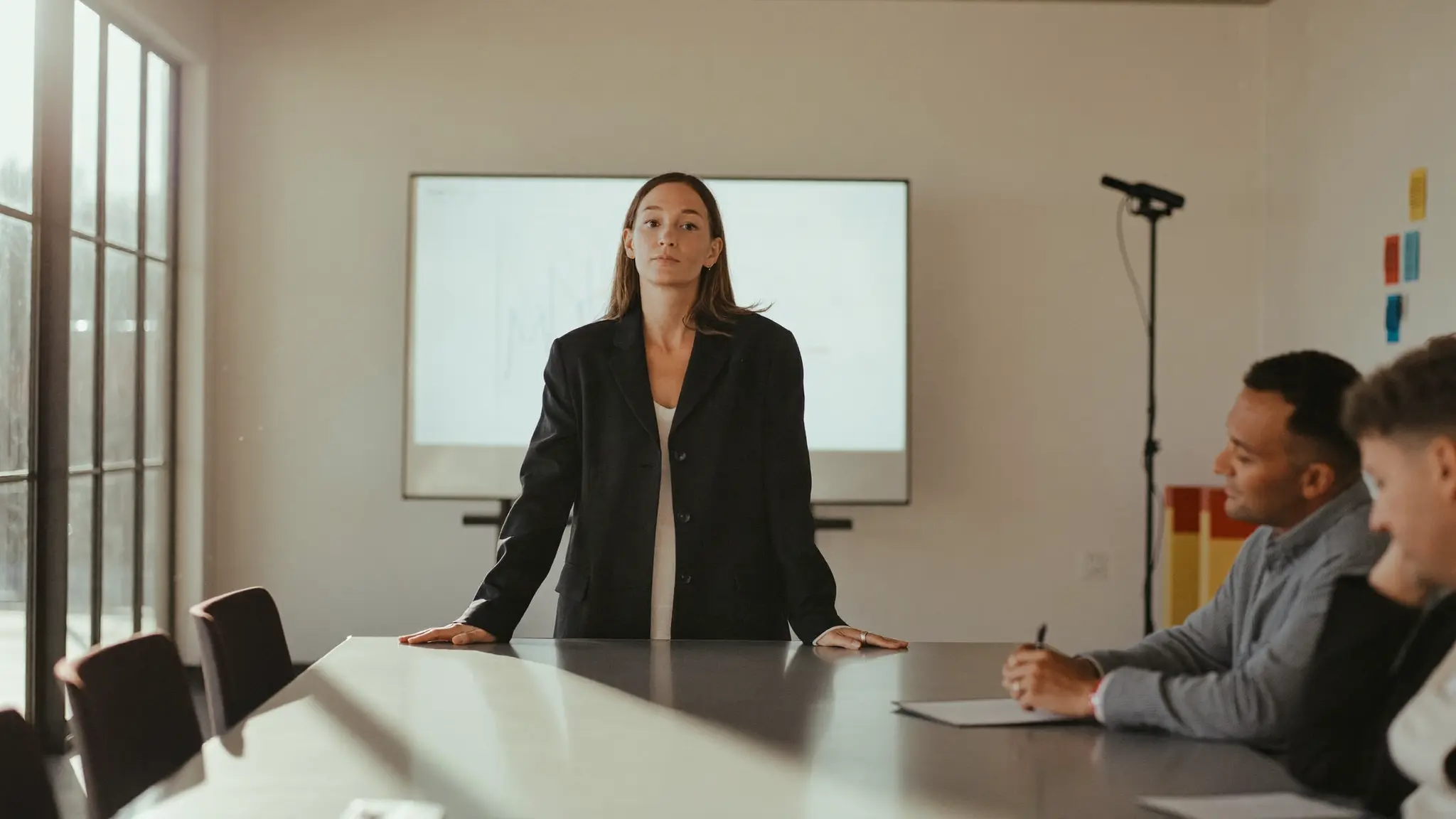 Confident HR director presenting in a boardroom